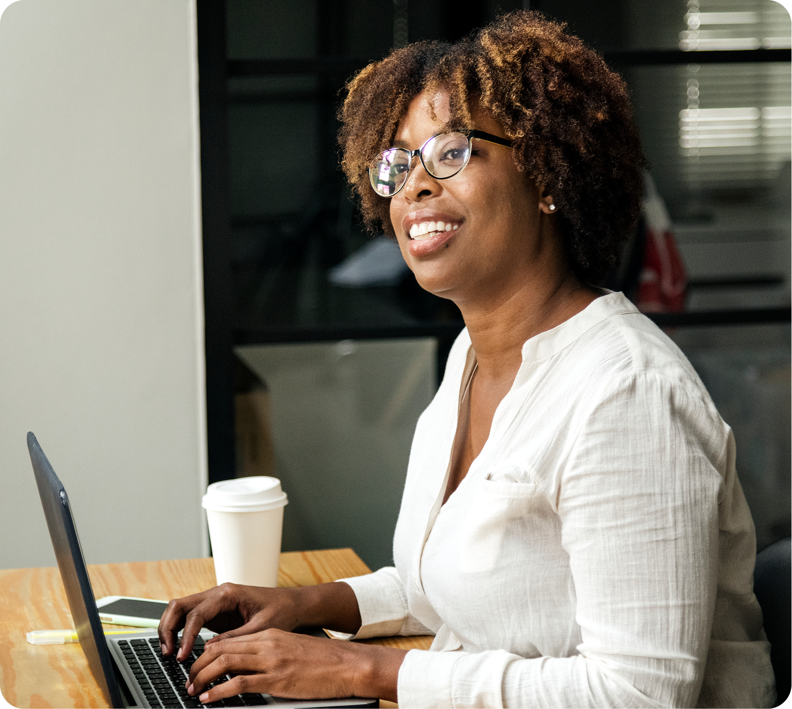 woman-using-laptop-meeting-room 1